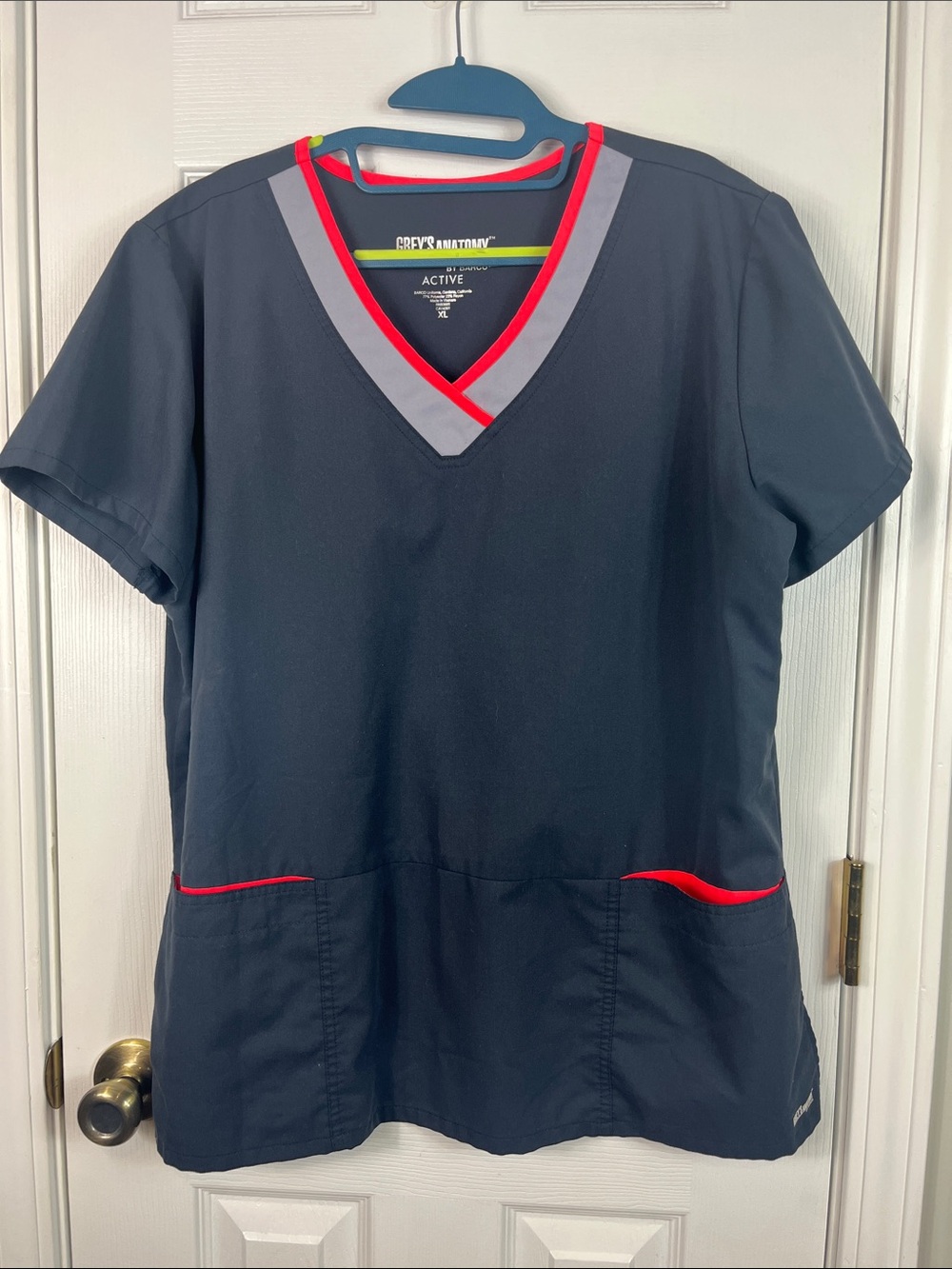 Grey’s Anatomy dark grey short sleeved scrub top size XL. Grey/pink accents.